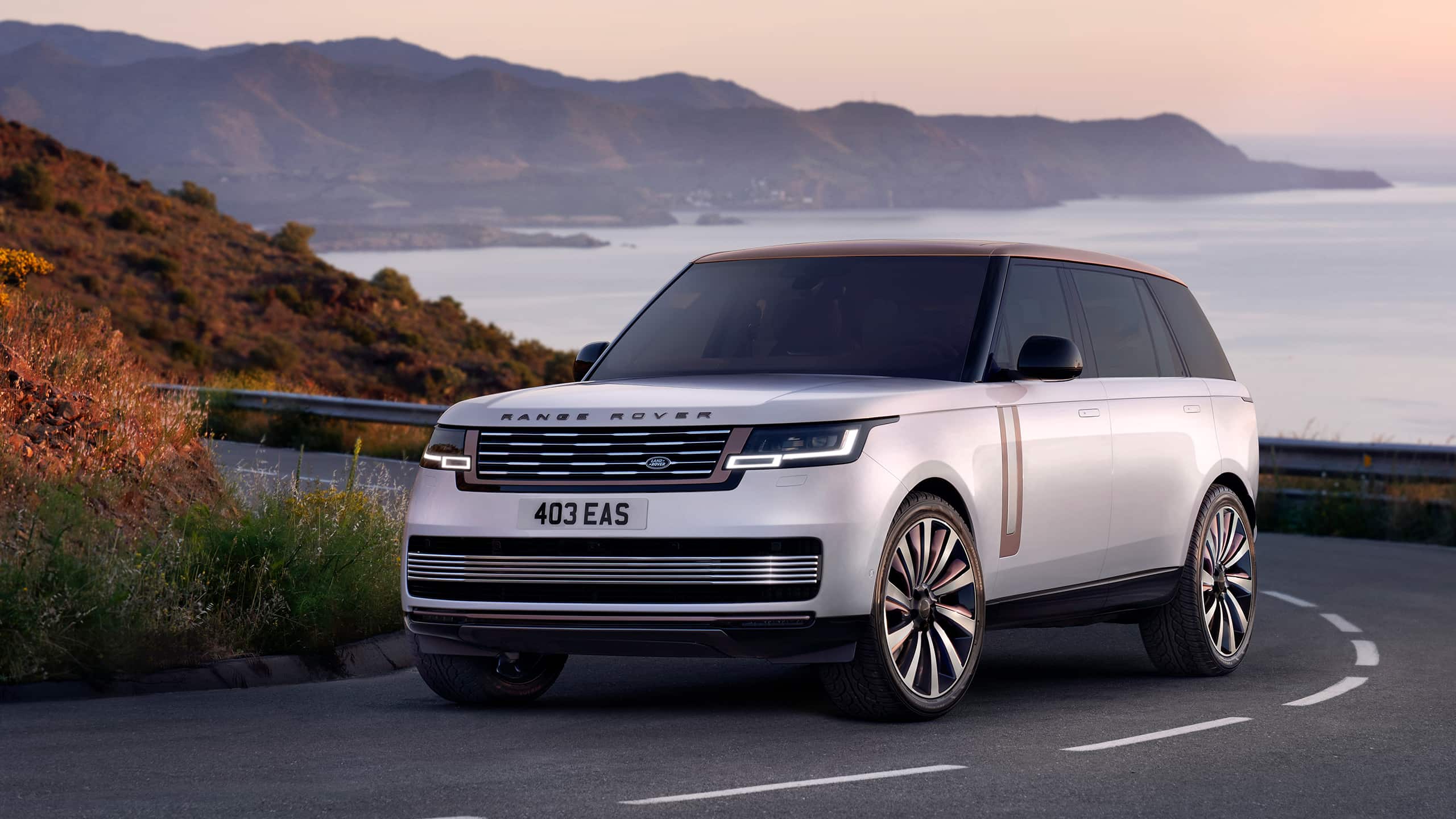 Range Rover driving on costal highway