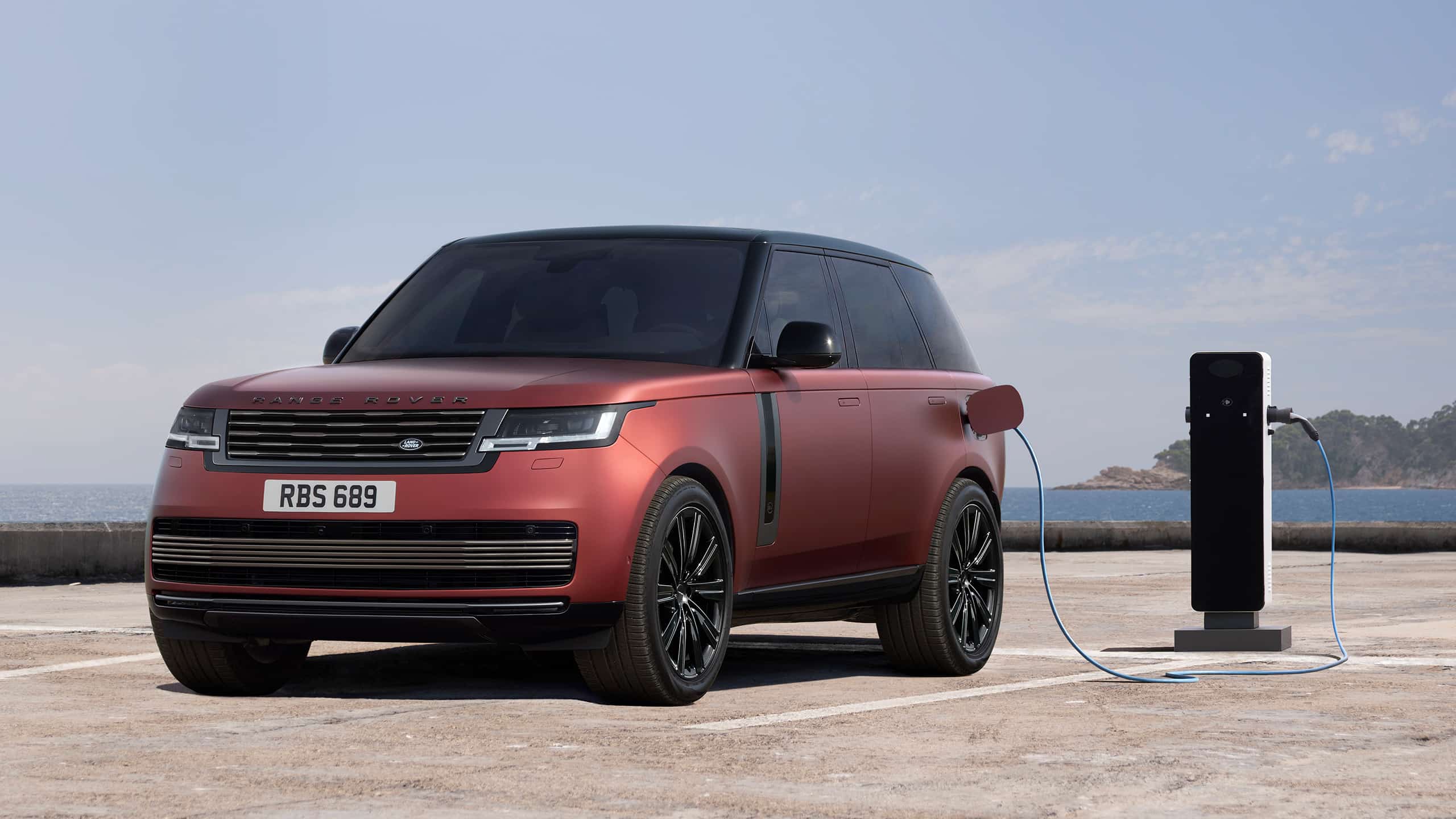 Range Rover parked in electric EV station
