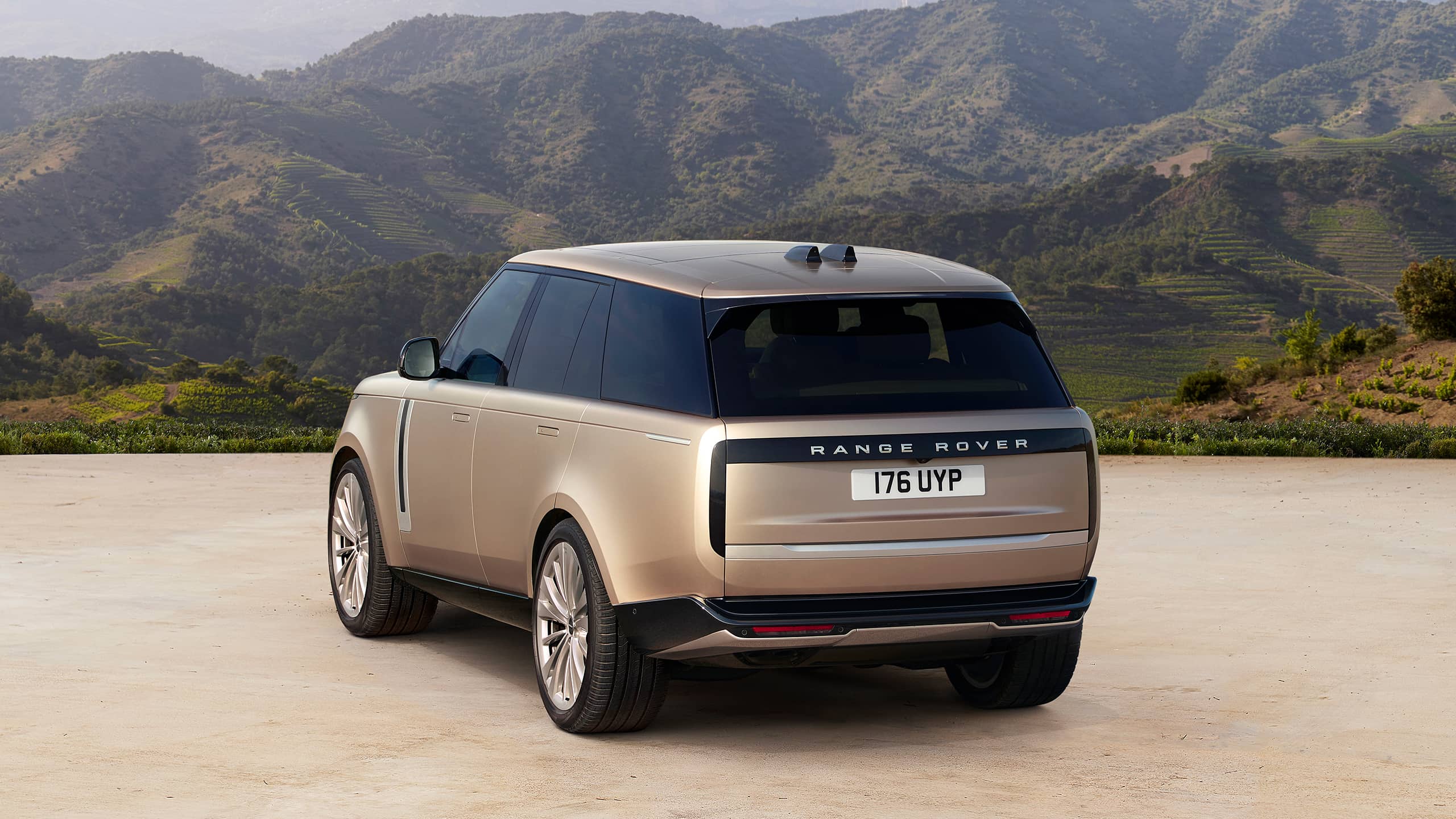 Range Rover parked on open ground back view