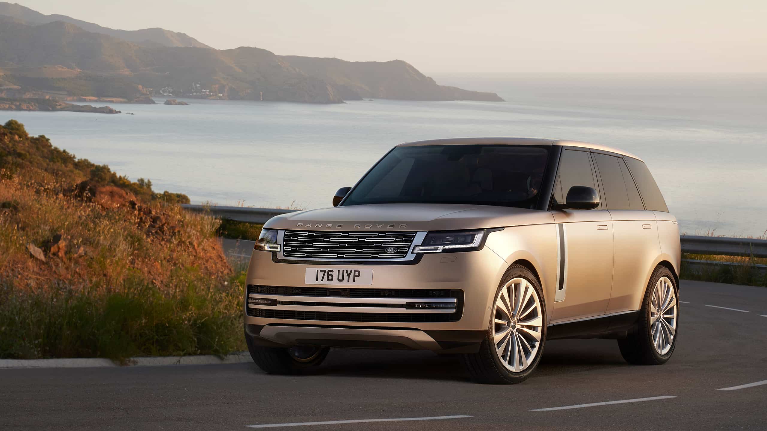Range Rover driving on costal highway