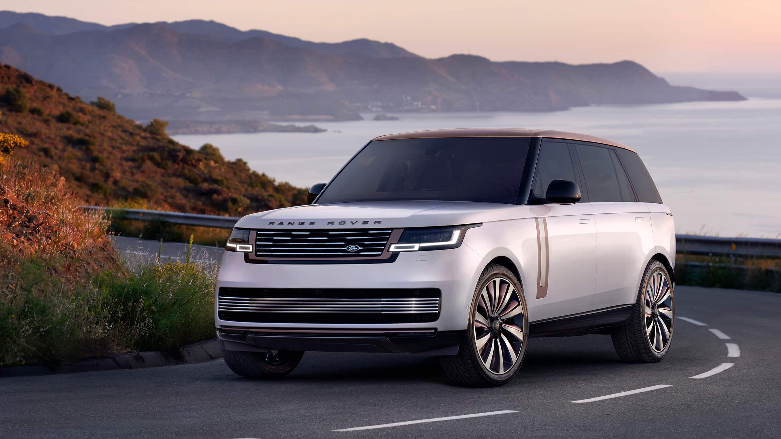 Range Rover driving on costal highway
