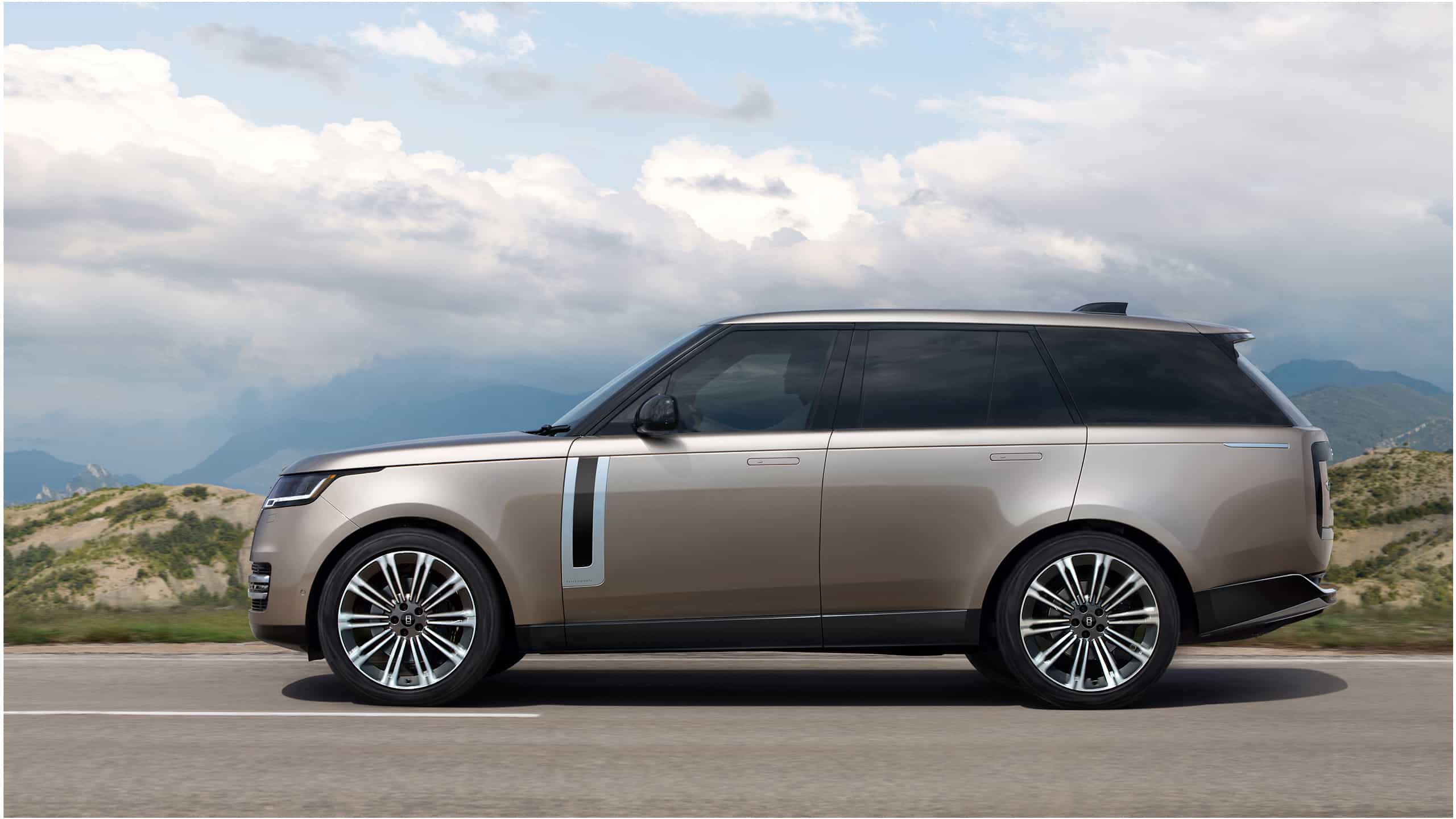 Range Rover driving on road