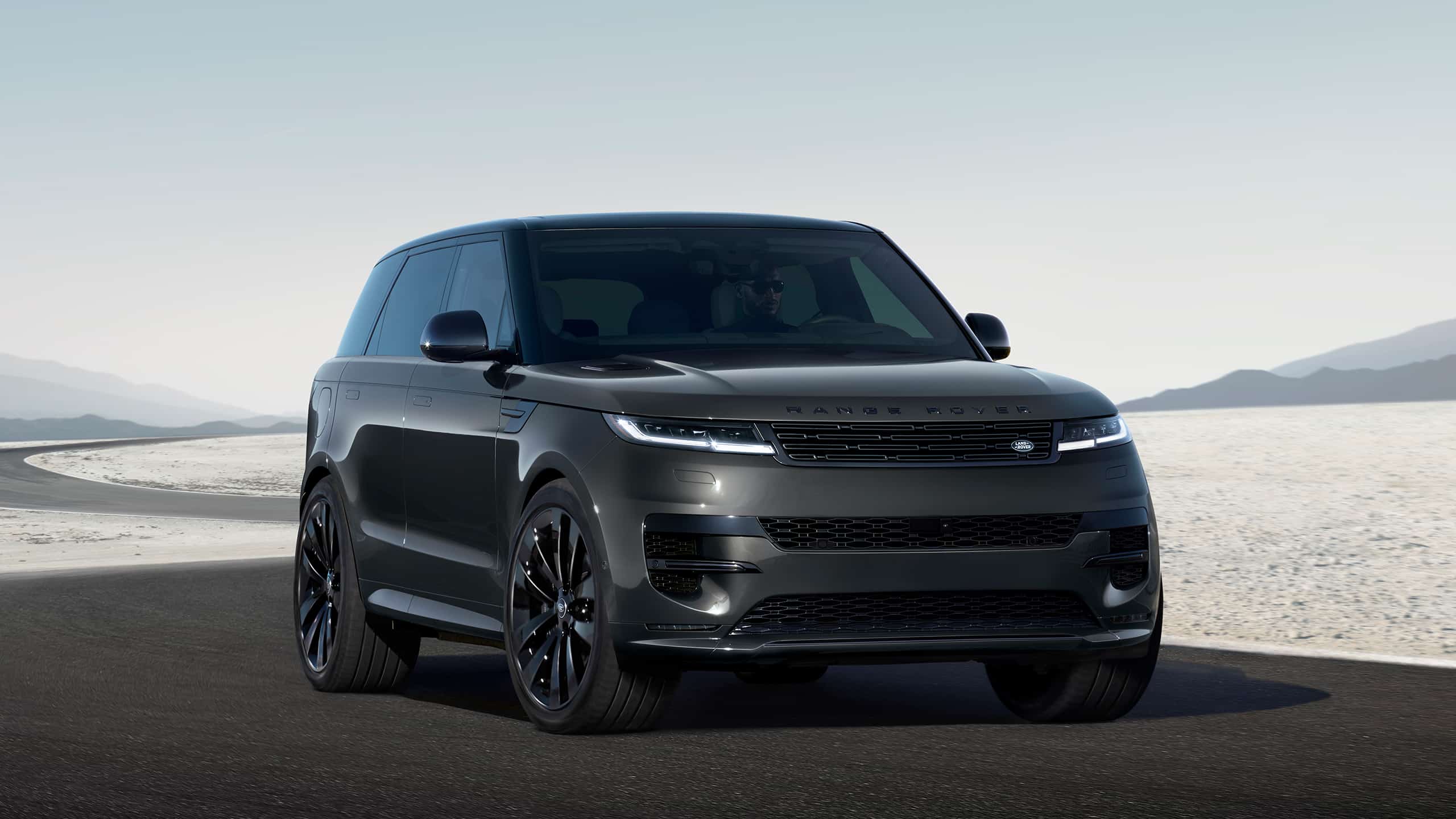 Range Rover Sports parked on curvy road