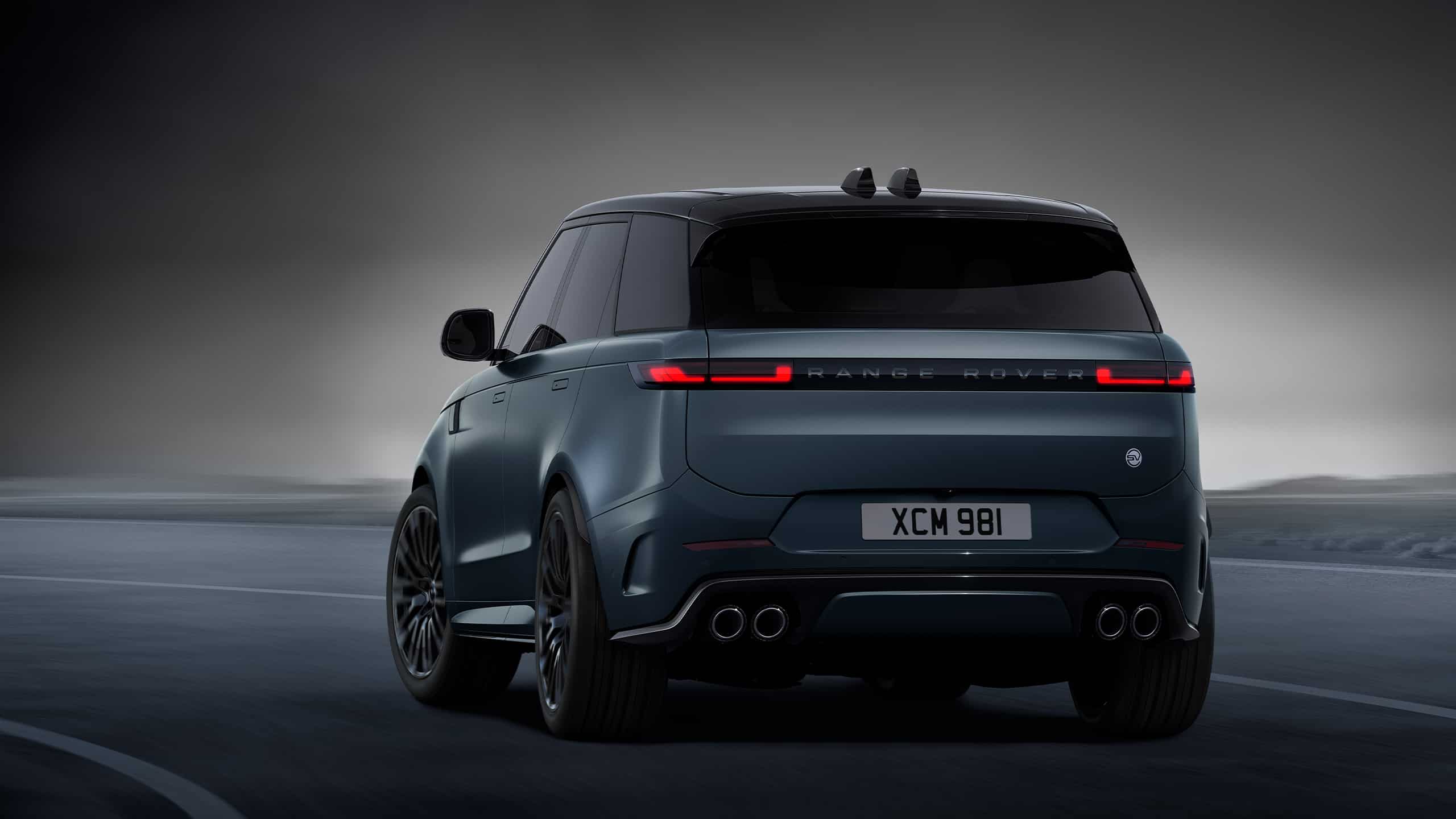 Range Rover sports standing on road back view